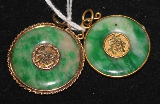 Two Chinese yellow metal mounted jade disc pendants.